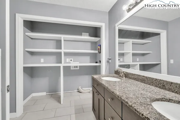 a kitchen with a granite countertop sink