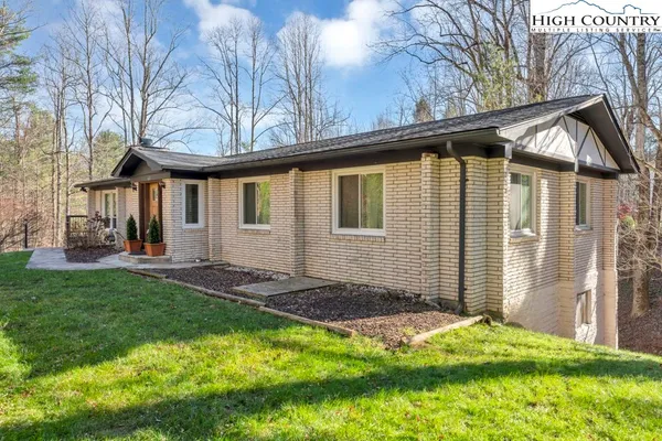 a backyard of a house with lots of green space