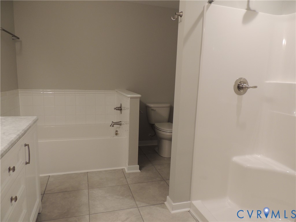 4417 Olgers Road Sutherland, VA 23885 - Photo 14 of 24 Bathroom featuring a white vanity with a light-ton