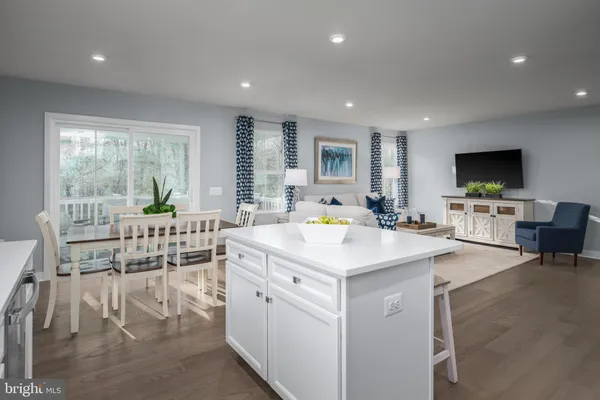 a view of living room with granite countertop furniture and a flat screen tv