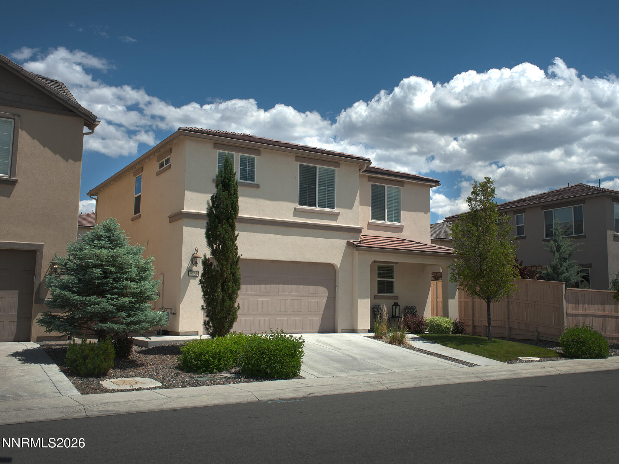 9766 Pachuca Drive Reno, NV 89521 - Photo 57 of 59 a front view of a house with a garden