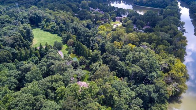 a view of a house with a tree