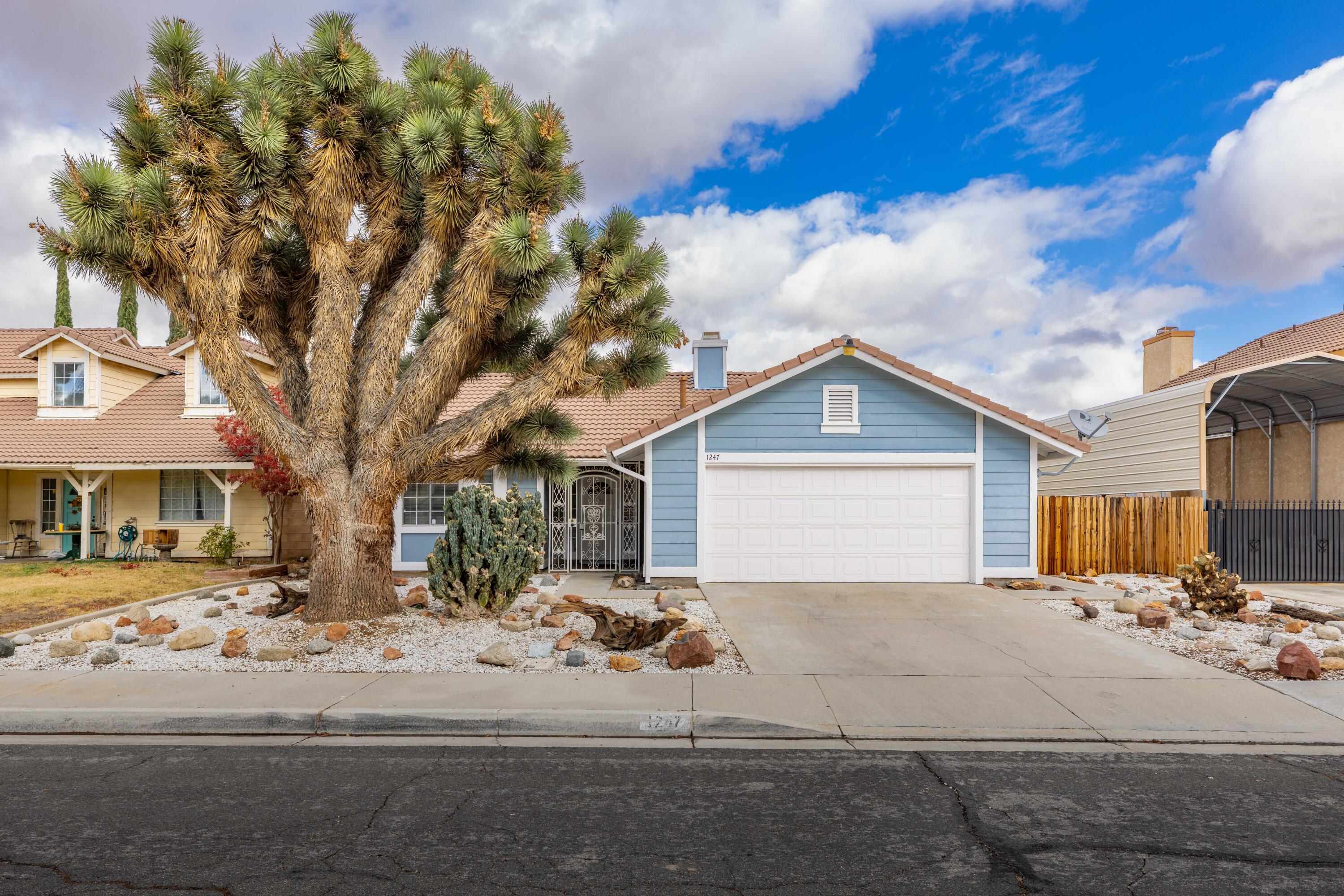 1247 Coventry Place Palmdale, CA 93551 - Photo 1 of 20 a view of a house with a yard