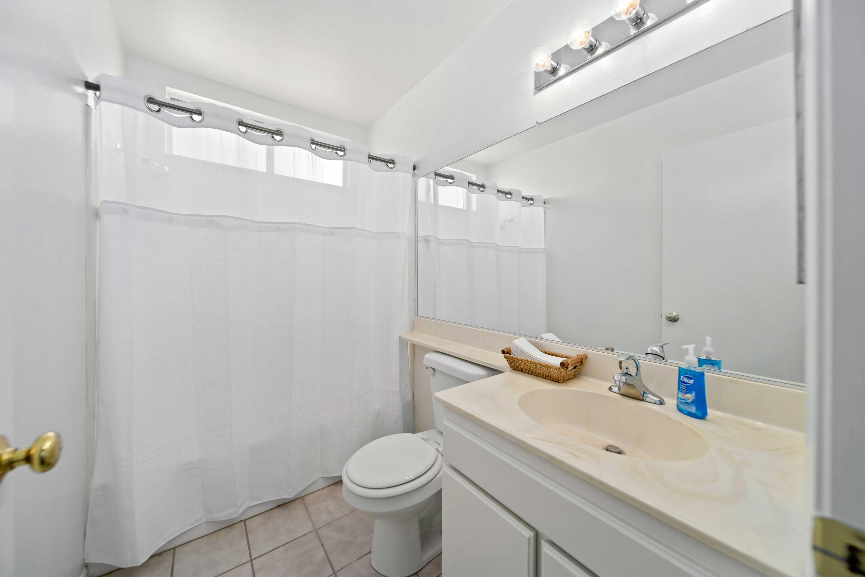 1247 Coventry Place Palmdale, CA 93551 - Photo 13 of 20 a bathroom with a sink a toilet and shower