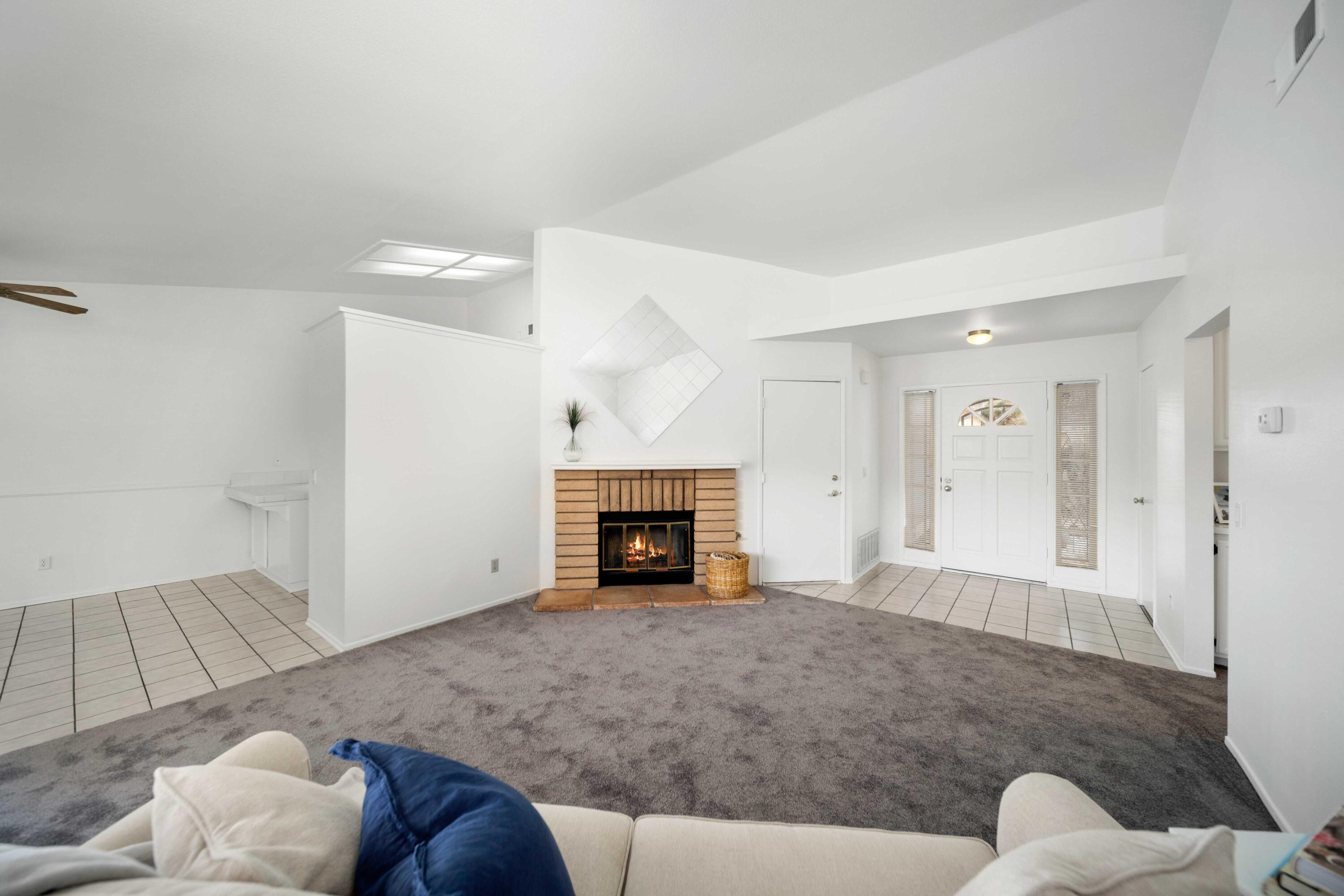 1247 Coventry Place Palmdale, CA 93551 - Photo 5 of 20 a living room with furniture and a fireplace