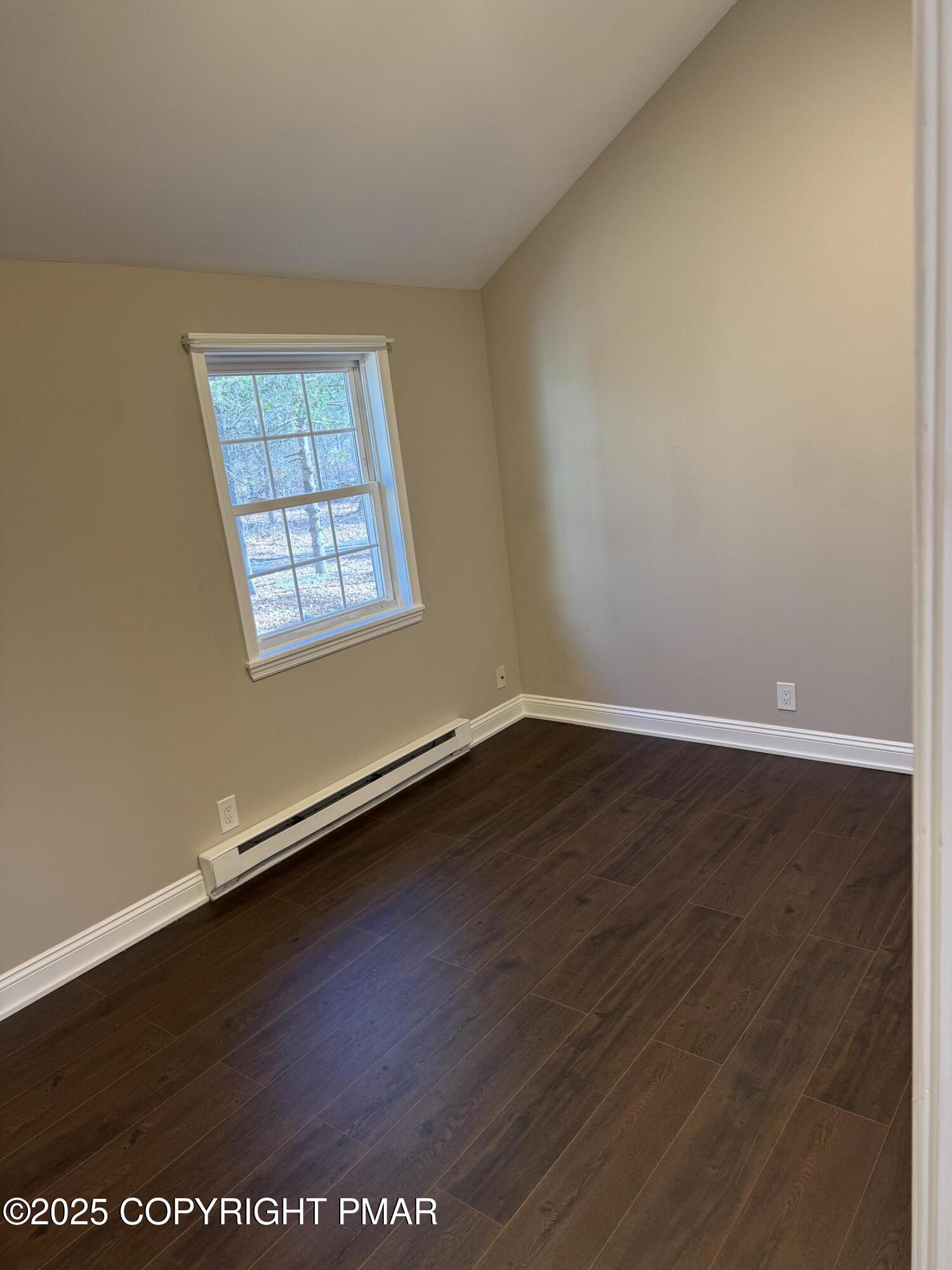 867 Underwood Road West East Stroudsburg, PA 18302 - Photo 17 of 36 an empty room with wooden floor and windows
