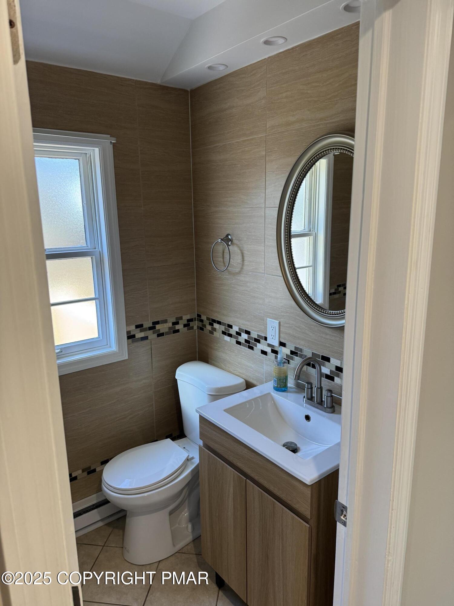 867 Underwood Road West East Stroudsburg, PA 18302 - Photo 25 of 36 a bathroom with a toilet sink and mirror