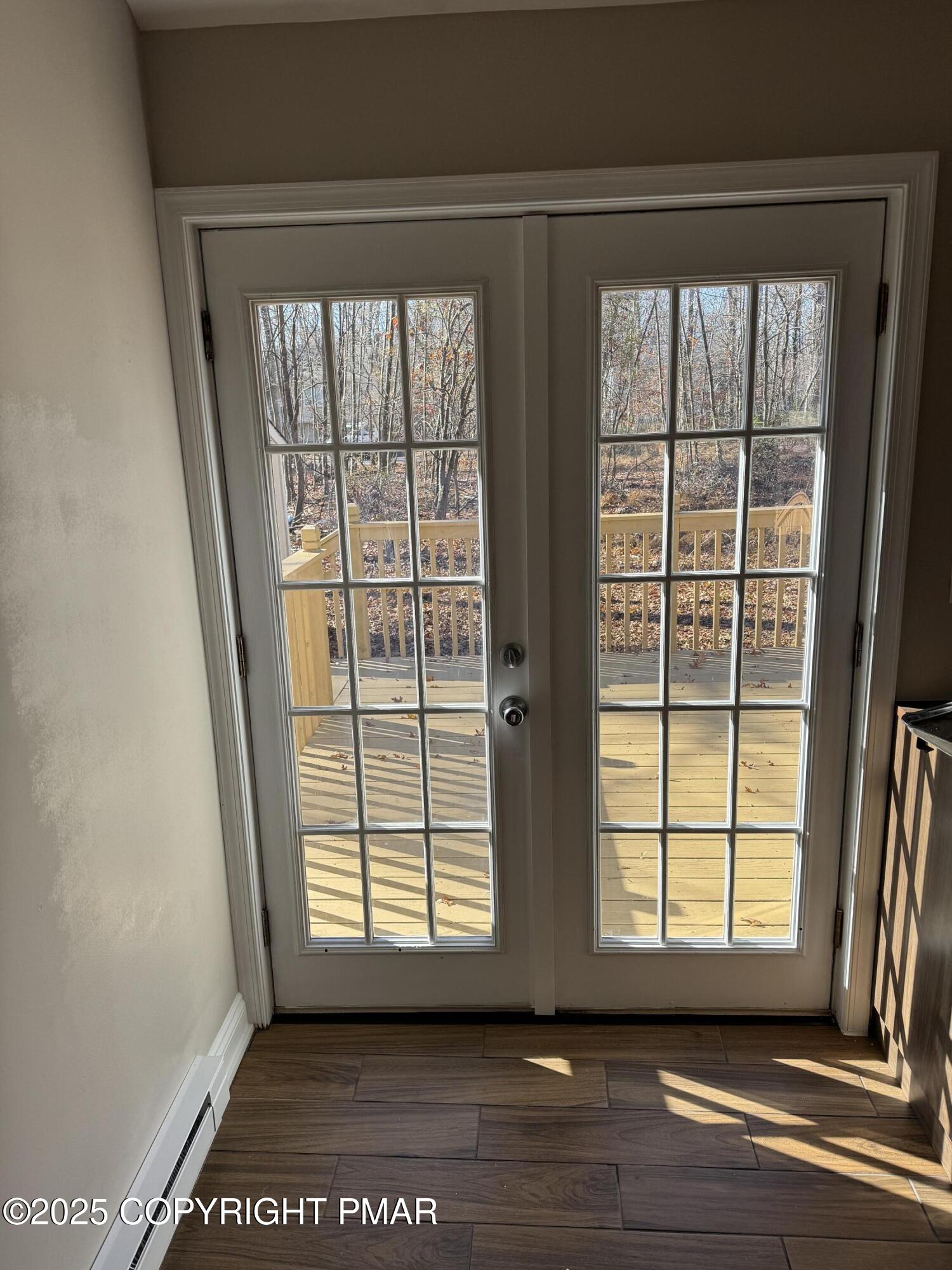 867 Underwood Road West East Stroudsburg, PA 18302 - Photo 27 of 36 an empty room with wooden floor and windows