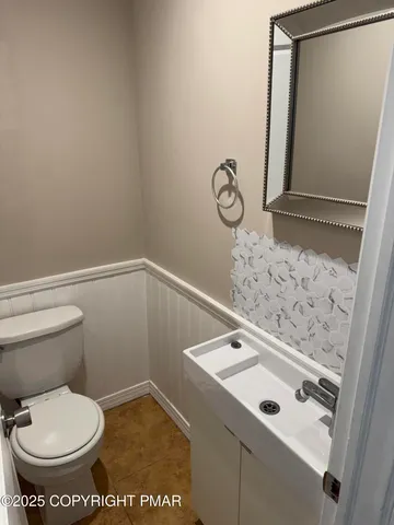 a bathroom with a toilet and a sink