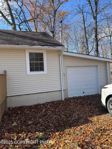 a side view of a house with a yard