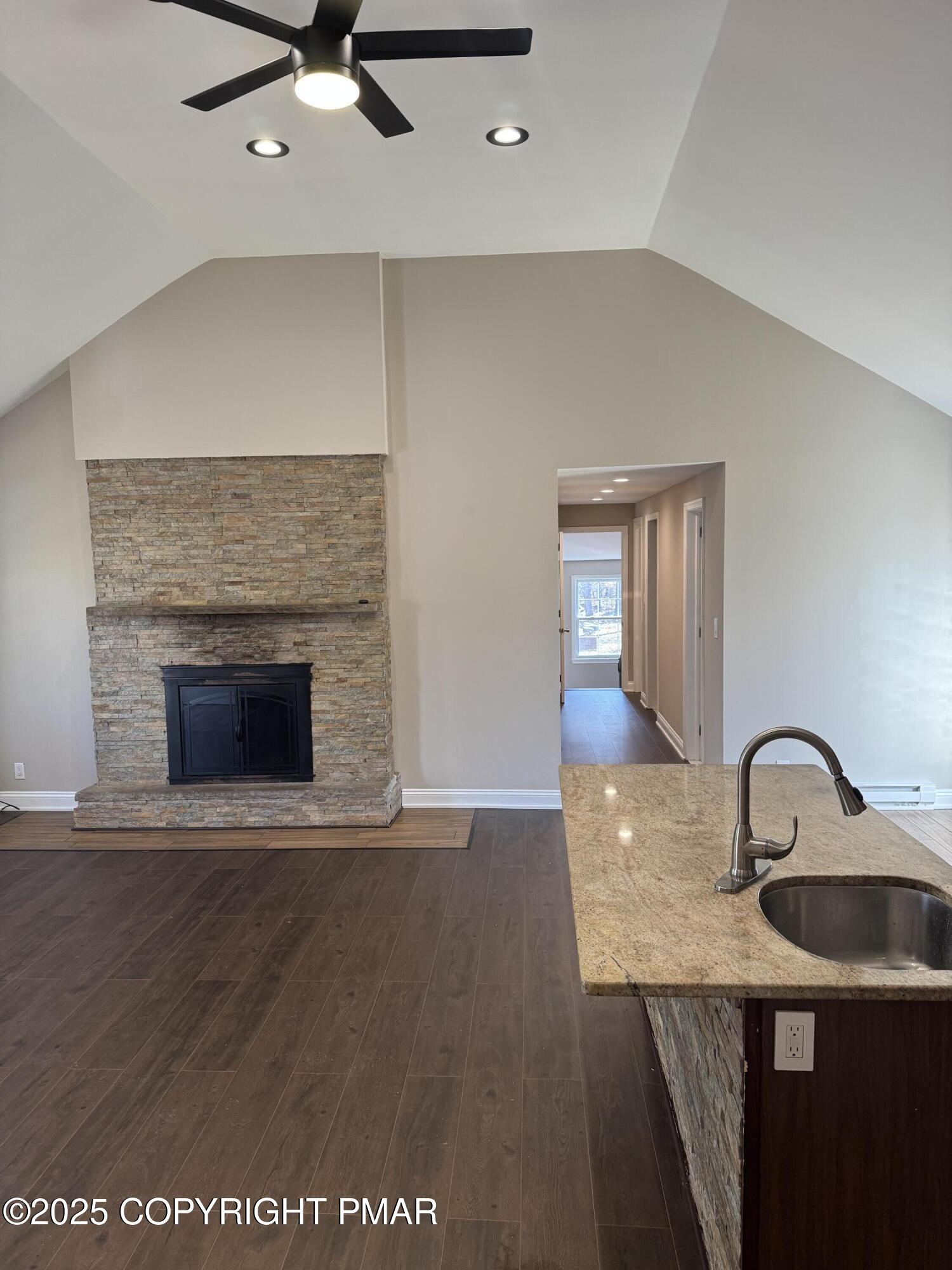 867 Underwood Road West East Stroudsburg, PA 18302 - Photo 9 of 36 a view of a livingroom with a sink and fireplace