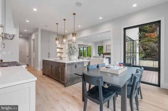 a spacious bedroom with a large bed couch and a large window