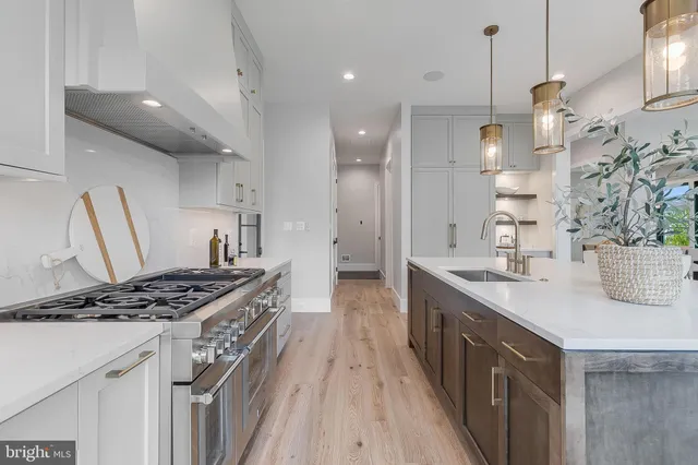 a spacious bedroom with a large bed and a large window