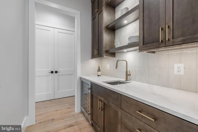 a spacious bathroom with a double vanity sink shower and mirror