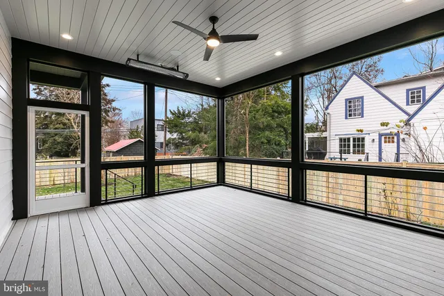 a spacious bathroom with a granite countertop sink and a mirror