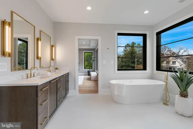 a living room with furniture and view of kitchen