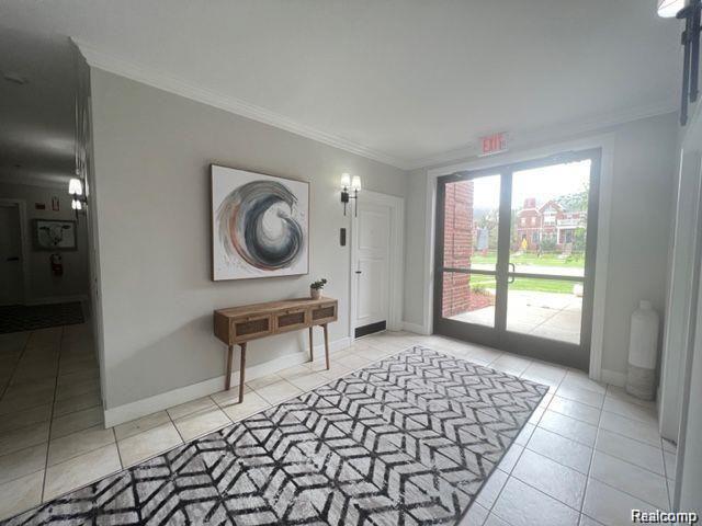 2727 East Maple Road Birmingham, MI 48009 - Photo 10 of 29 Tile flooring with neutral wall tones and crown molding