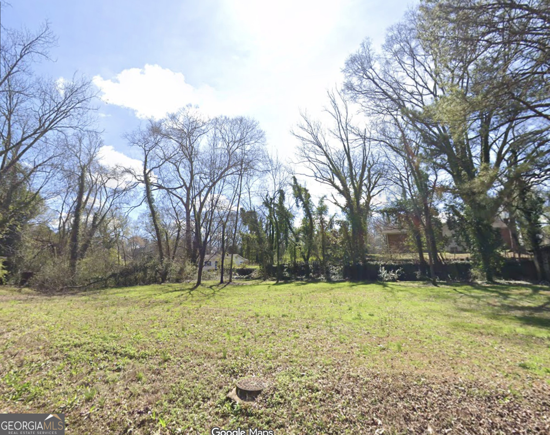 a view of swimming pool with trees in the background