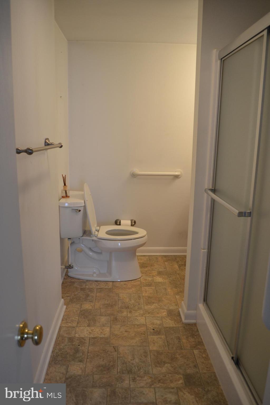1241 Duke Lane Odenton, MD 21113 - Photo 11 of 26 a bathroom with a toilet and a shower
