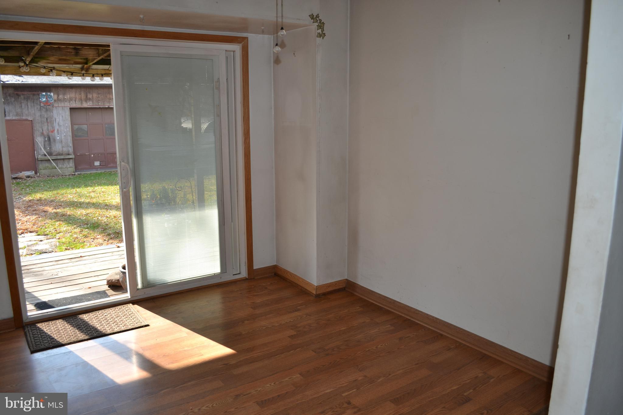 1241 Duke Lane Odenton, MD 21113 - Photo 13 of 26 an empty room with wooden floor and windows