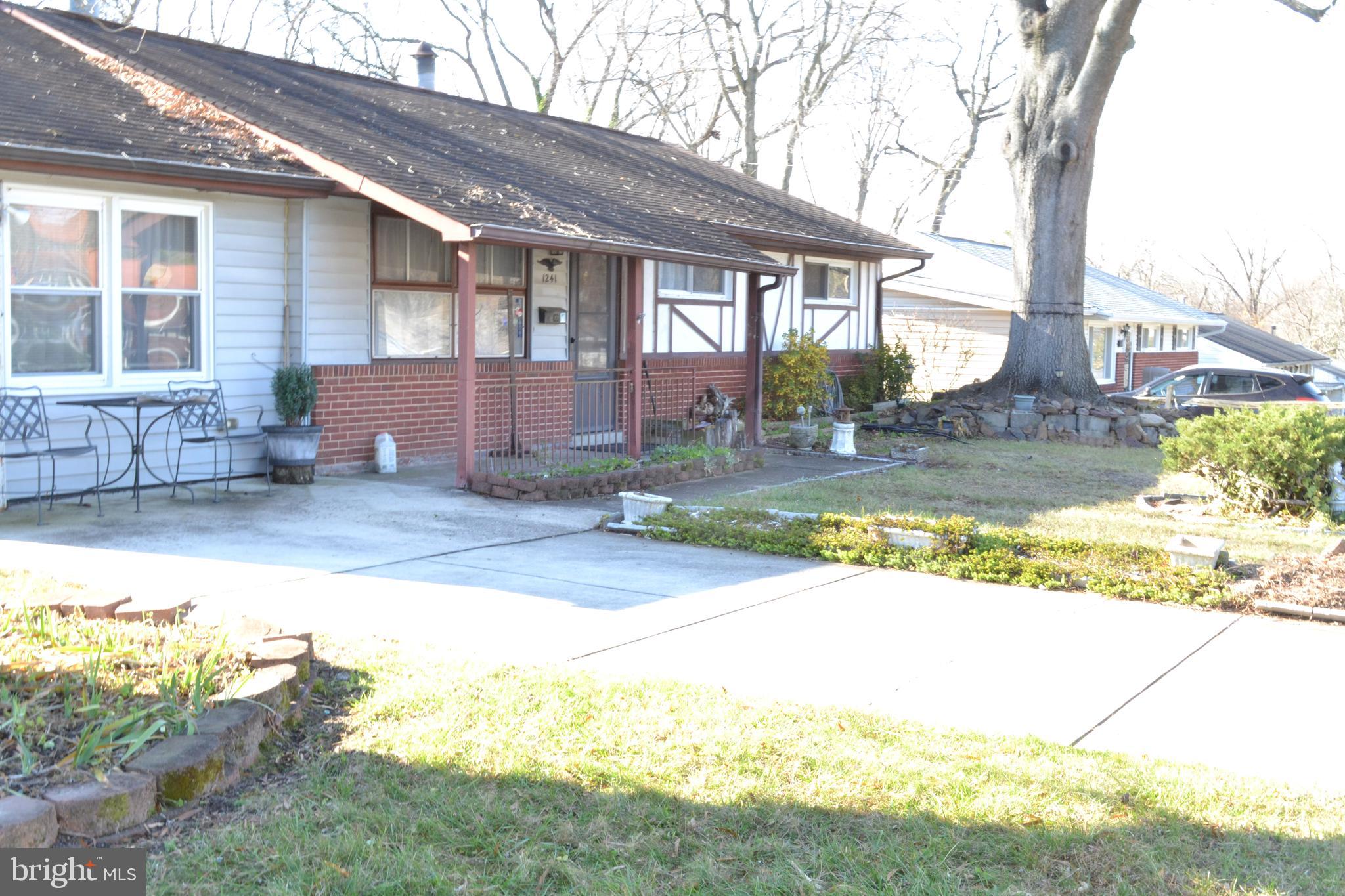 1241 Duke Lane Odenton, MD 21113 - Photo 2 of 26 a view of a house with a yard and sitting area