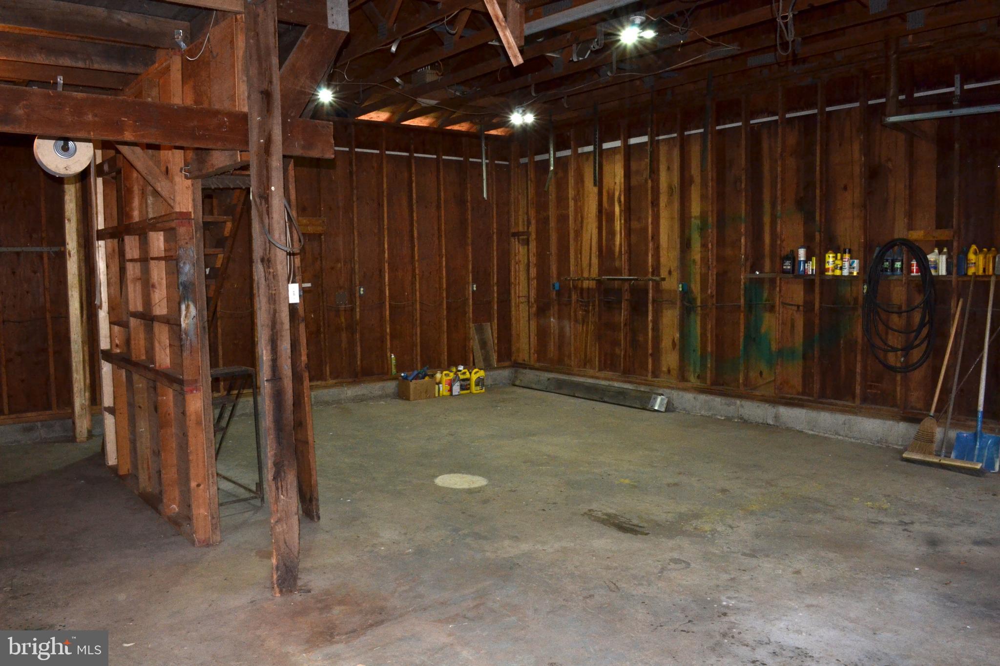1241 Duke Lane Odenton, MD 21113 - Photo 21 of 26 a view of an empty room with wooden walls