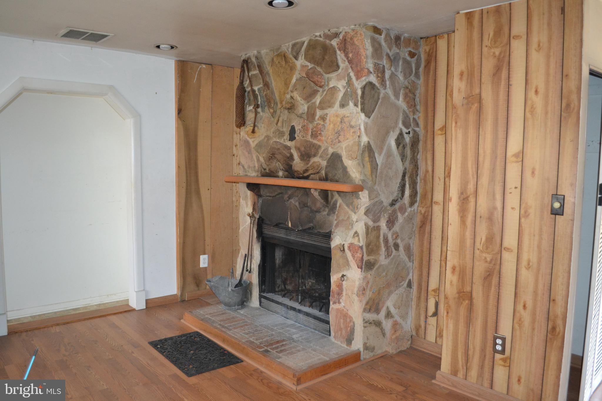 1241 Duke Lane Odenton, MD 21113 - Photo 7 of 26 a view of wooden floor with a fireplace