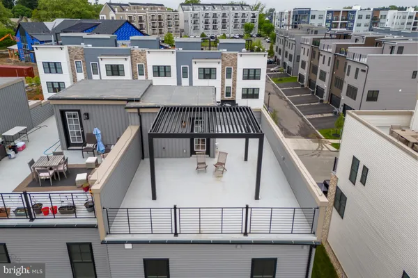 a view of balcony with furniture and wooden floor