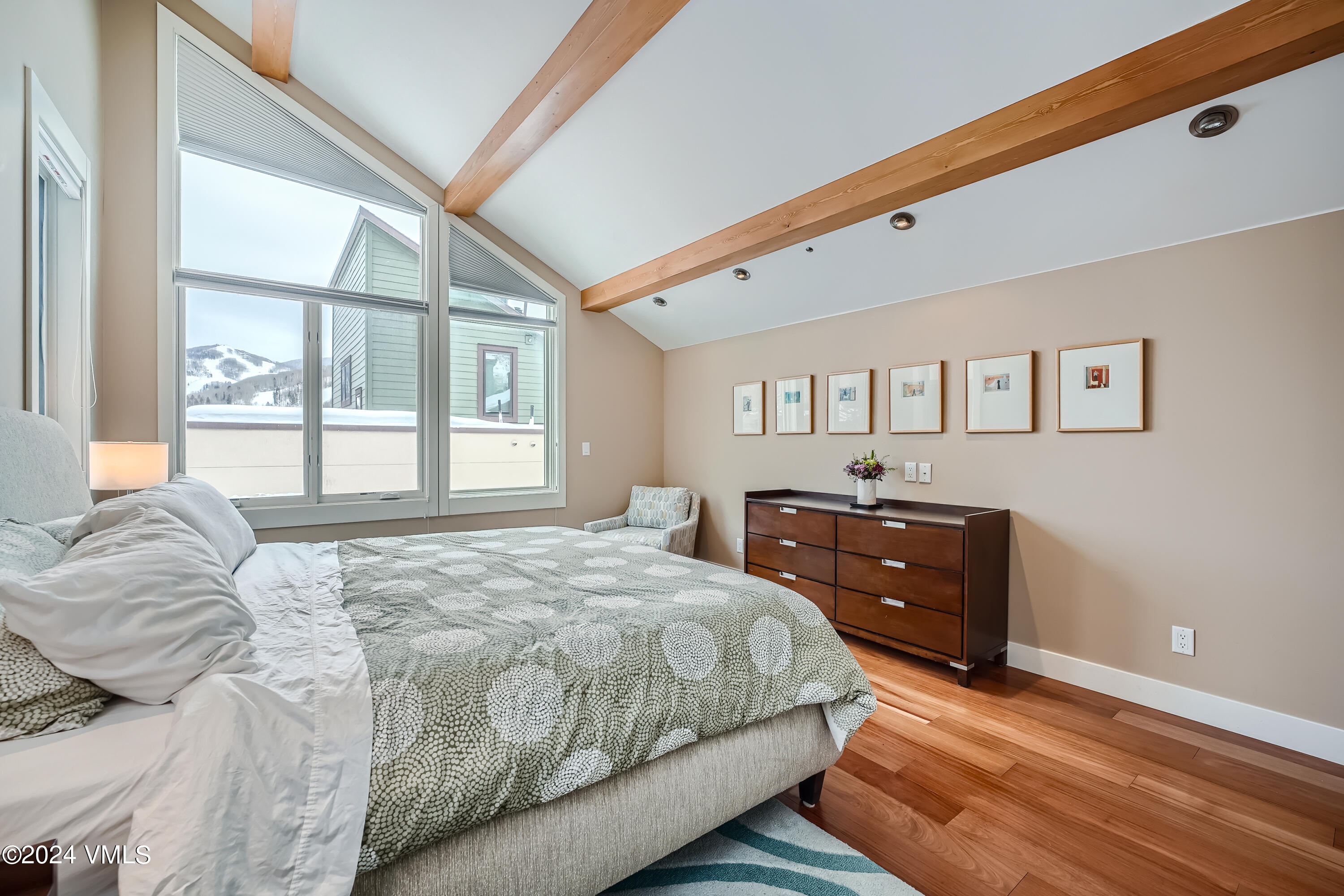 963 Lions Ridge Loop, Unit 535 Vail, CO 81657 - Photo 12 of 26 a bedroom with a bed window and a dresser
