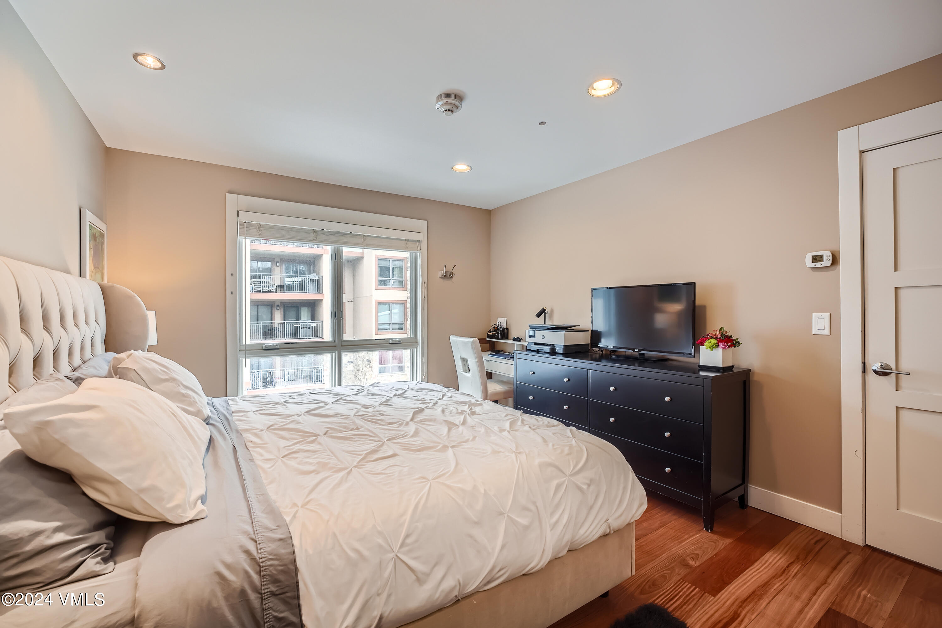 963 Lions Ridge Loop, Unit 535 Vail, CO 81657 - Photo 15 of 26 a bedroom with a bed and a tv