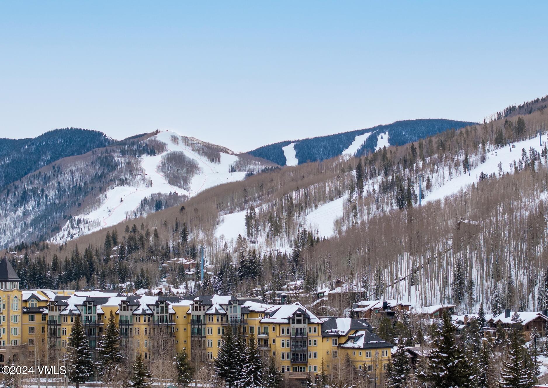 963 Lions Ridge Loop, Unit 535 Vail, CO 81657 - Photo 25 of 26 a view of a town with mountains