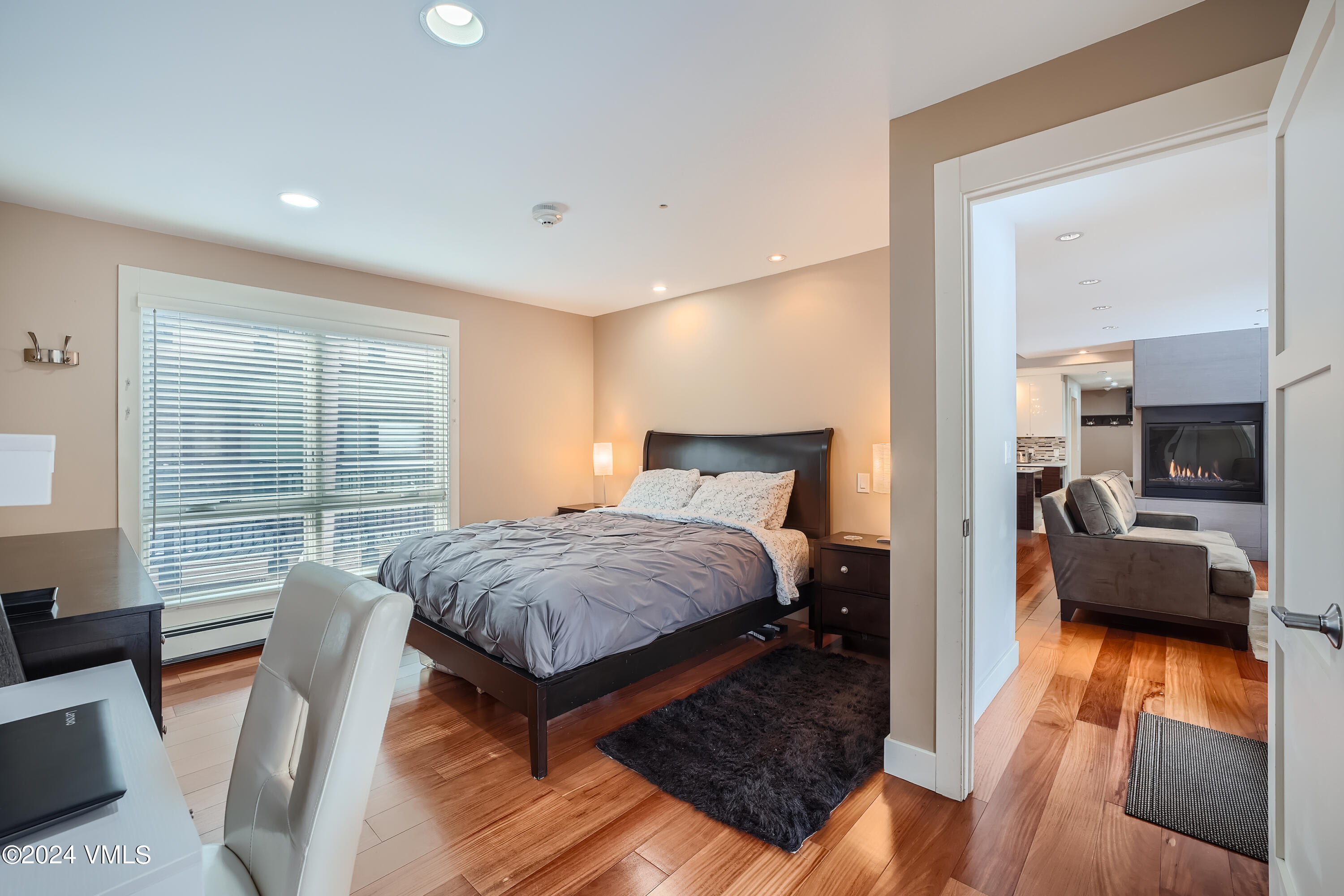 963 Lions Ridge Loop, Unit 535 Vail, CO 81657 - Photo 7 of 26 a bedroom with a large bed and a couch