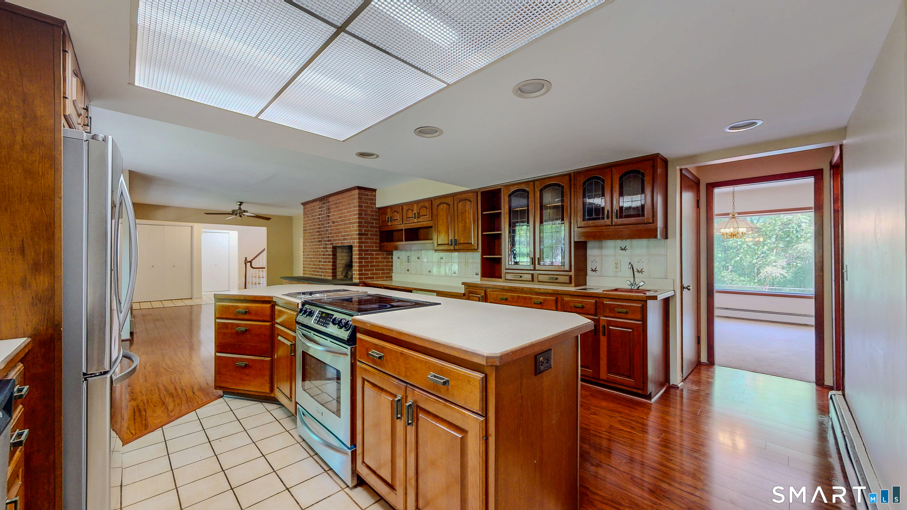 133 Chambers Road Danbury, CT 06811 - Photo 5 of 30 a kitchen with stainless steel appliances granite countertop a stove a sink and a refrigerator