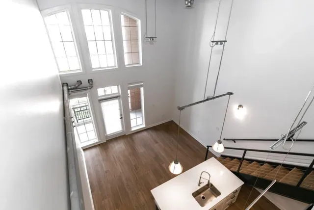 a view of an entryway with wooden floor