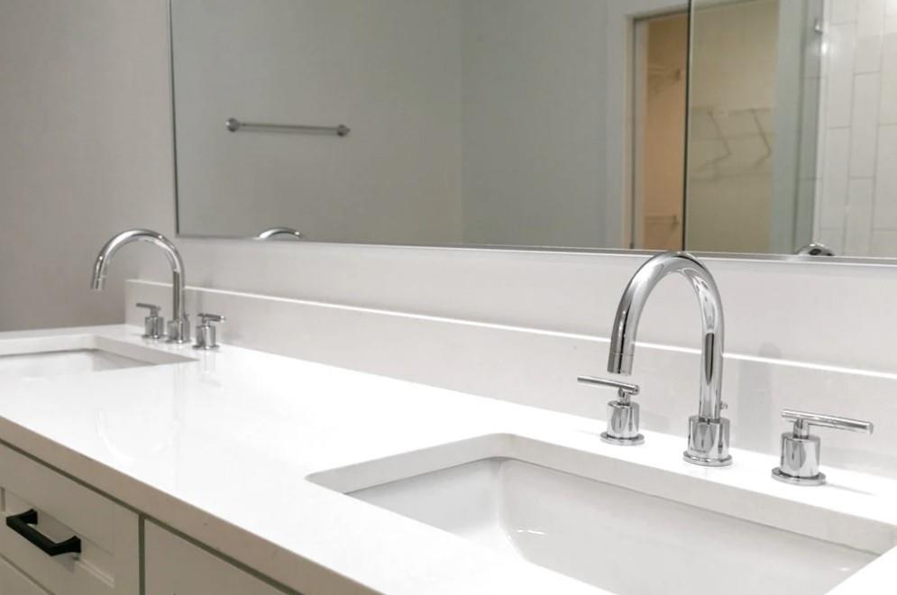 230 18th Street Northwest, Unit 11325 Atlanta, GA 30363 - Photo 14 of 43 a bathroom with a sink and a mirror