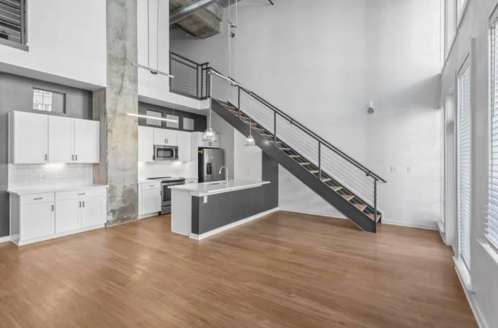 230 18th Street Northwest, Unit 11325 Atlanta, GA 30363 - Photo 19 of 43 a view of entryway and kitchen with wooden floor