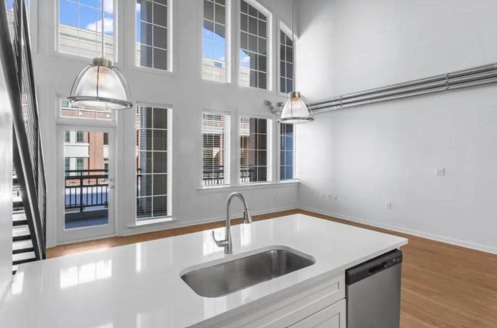 230 18th Street Northwest, Unit 11325 Atlanta, GA 30363 - Photo 23 of 43 a kitchen with a sink and a refrigerator
