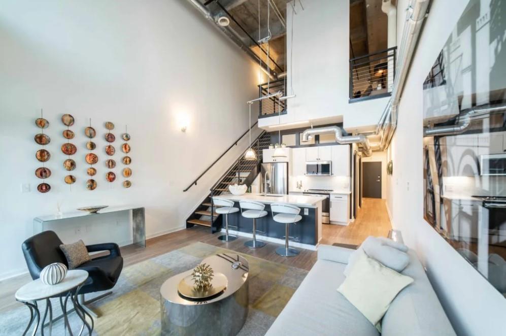 230 18th Street Northwest, Unit 11325 Atlanta, GA 30363 - Photo 8 of 43 a living room with furniture and wooden floor