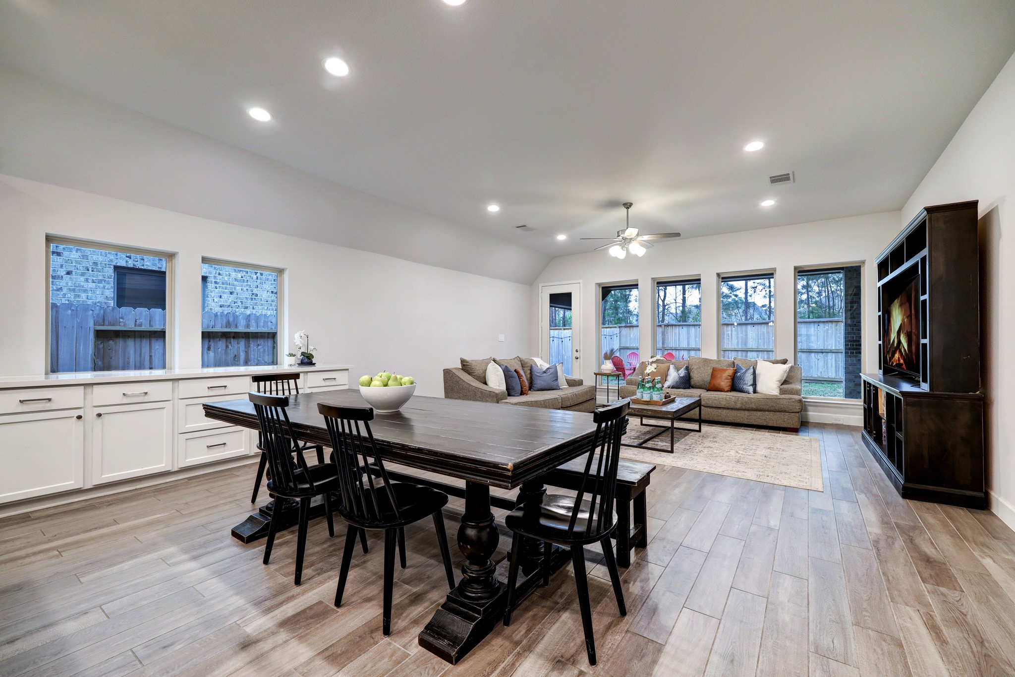 804 Fall Rock Branch Drive Conroe, TX 77304 - Photo 13 of 44 a view of a dining room with furniture and wooden floor