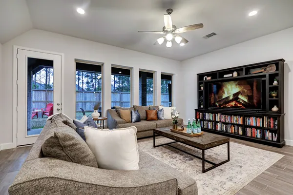 a living room with furniture and a flat screen tv