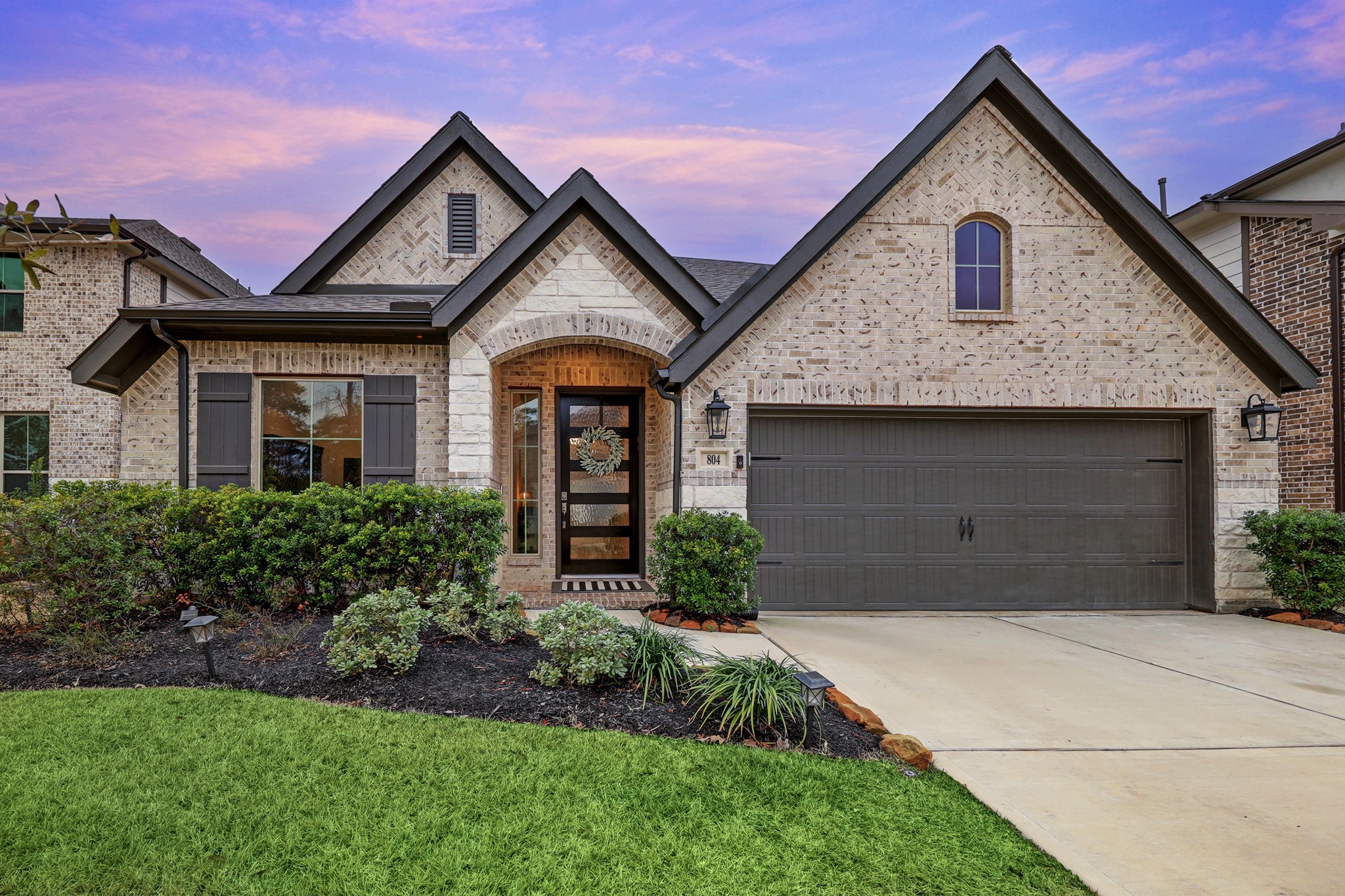 804 Fall Rock Branch Drive Conroe, TX 77304 - Photo 2 of 44 a front view of a house with a yard and garage