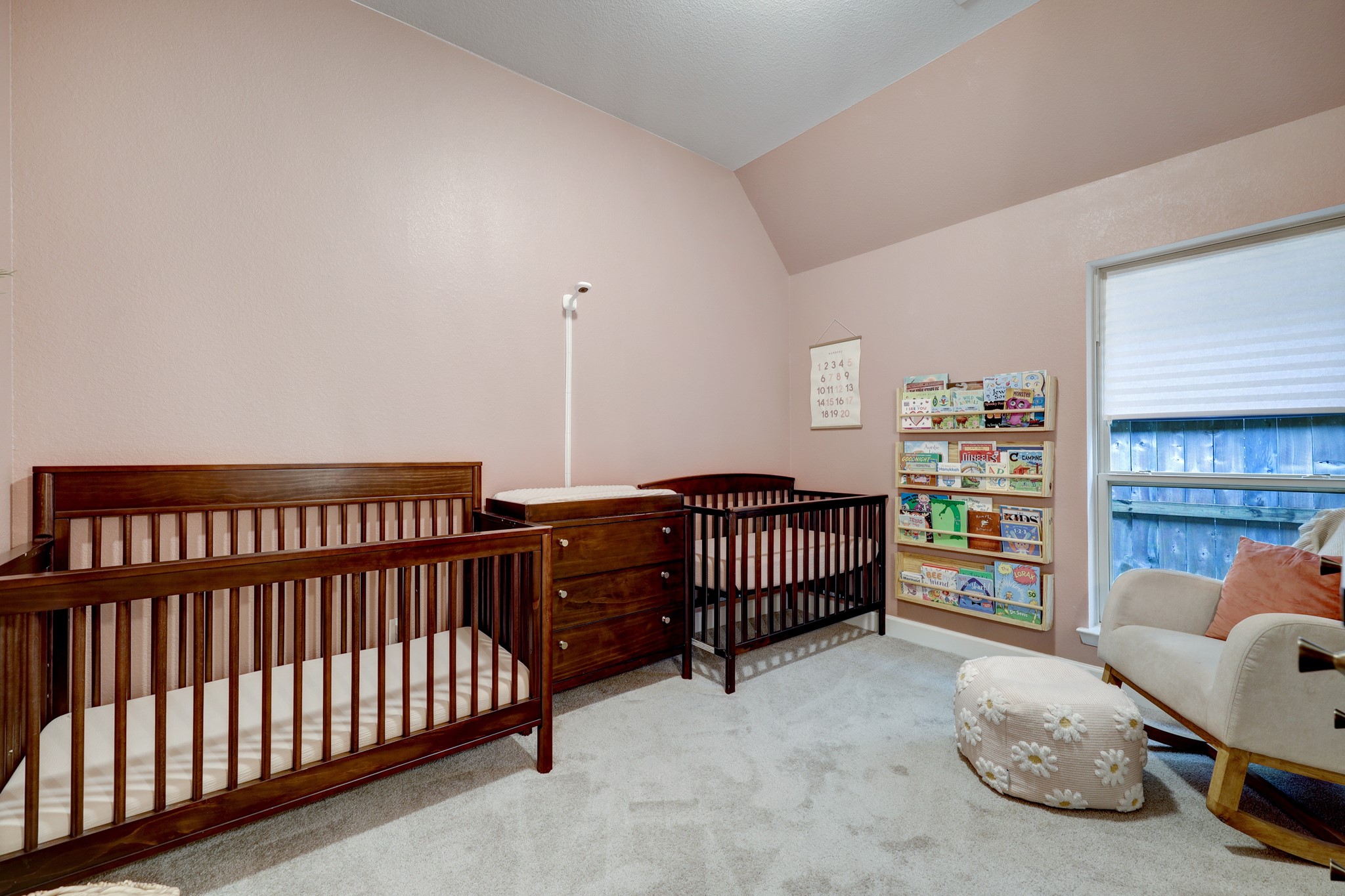 804 Fall Rock Branch Drive Conroe, TX 77304 - Photo 24 of 44 a bedroom with furniture and a book shelf