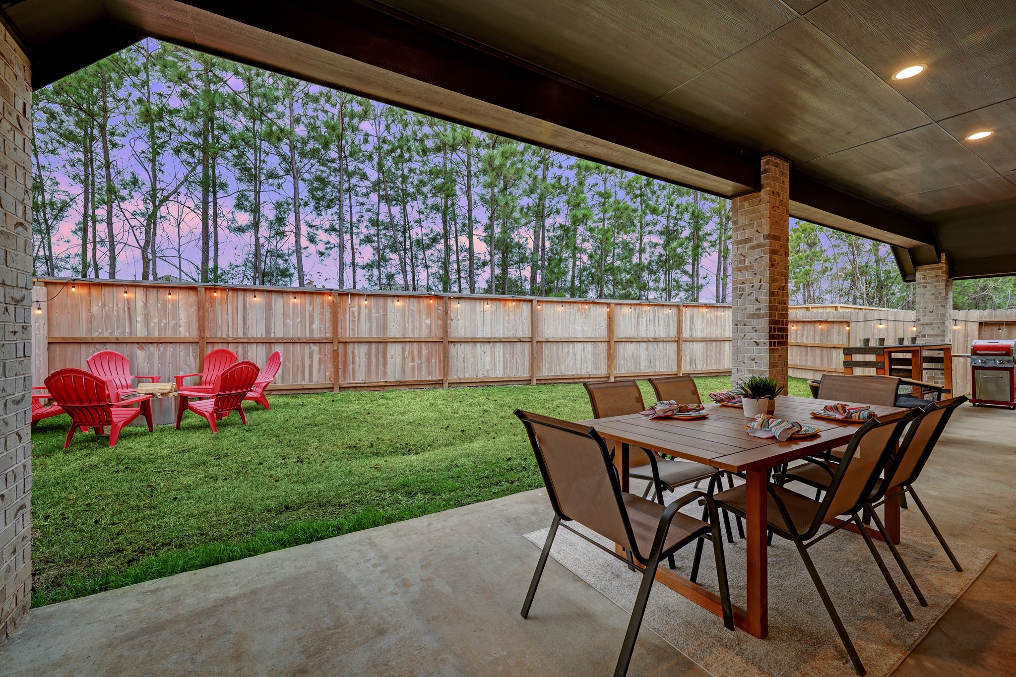 804 Fall Rock Branch Drive Conroe, TX 77304 - Photo 29 of 44 a view of yard from a dining room with furniture