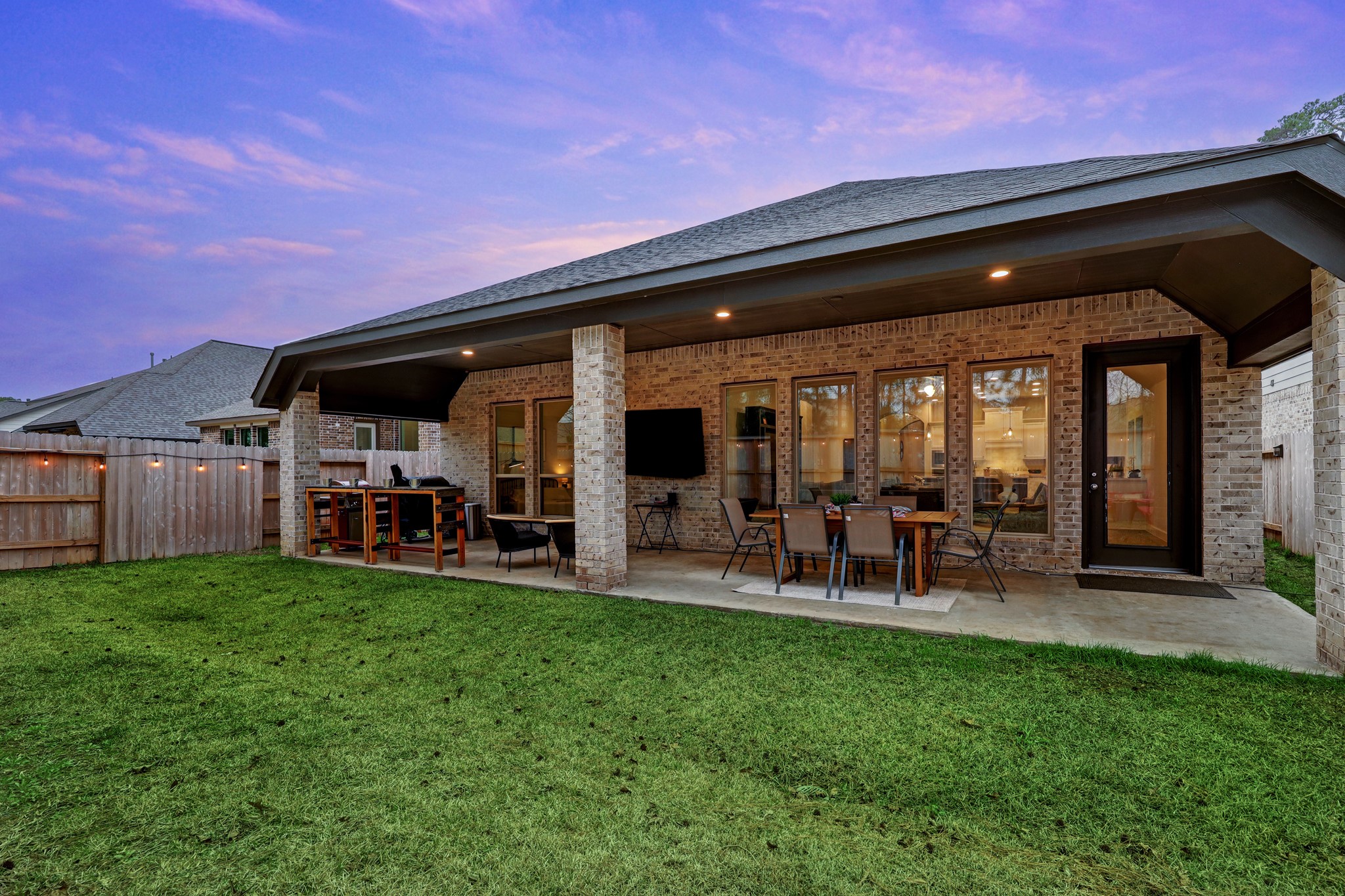 804 Fall Rock Branch Drive Conroe, TX 77304 - Photo 32 of 44 a view of a chairs and table in front of house