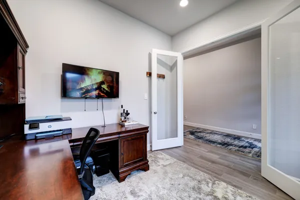 a room with furniture and a flat screen tv