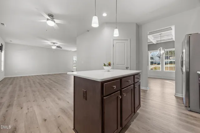 a bathroom with a sink a large mirror and vanity