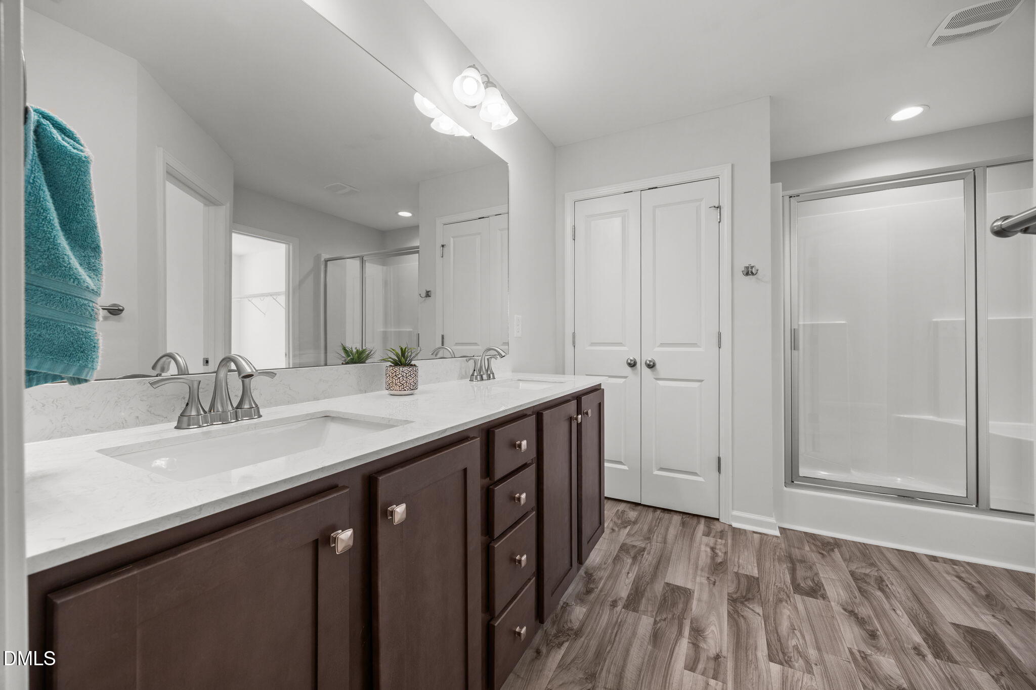 161 Starlight Road Lillington, NC 27546 - Photo 23 of 45 a bathroom with a sink a mirror and a shower