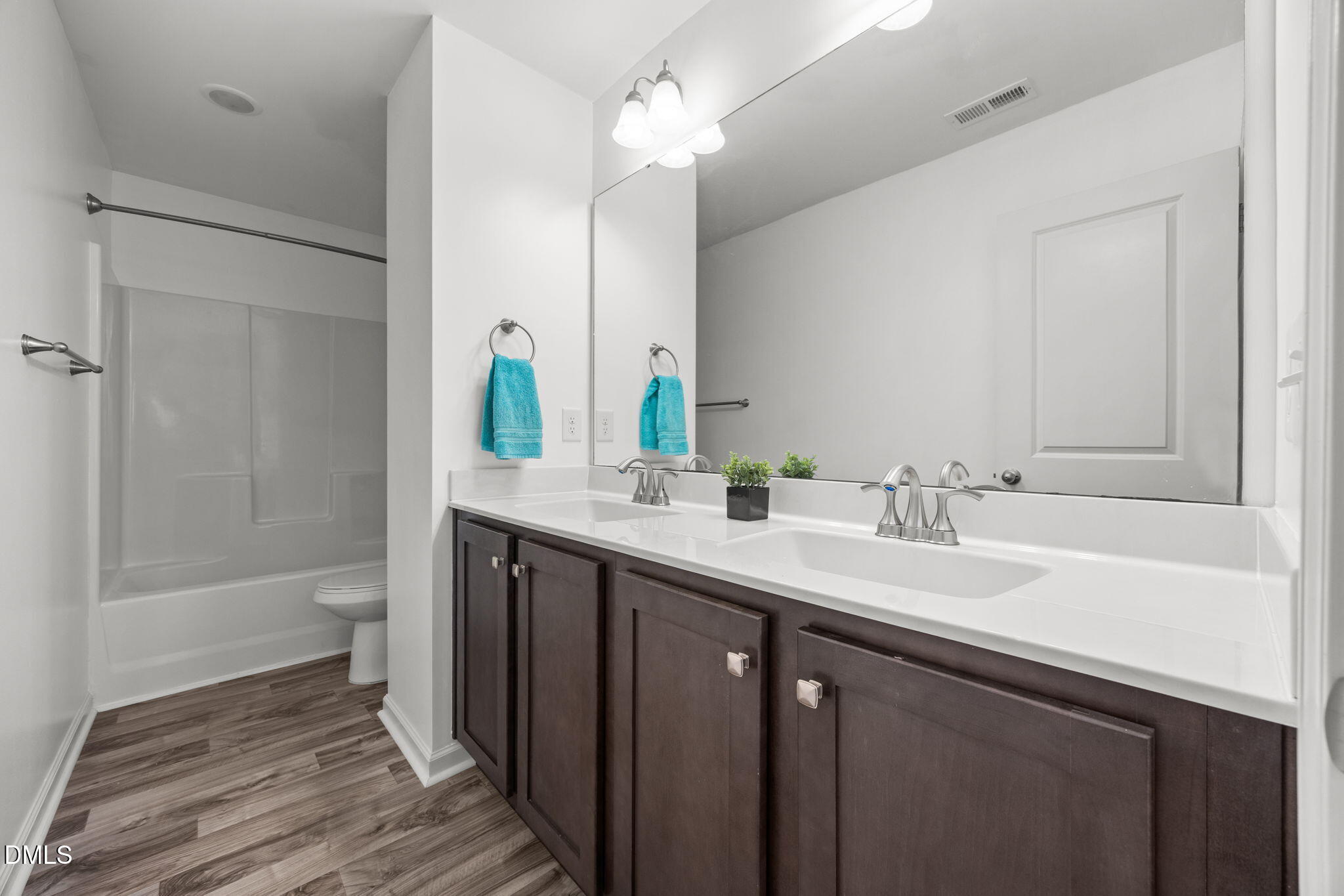 161 Starlight Road Lillington, NC 27546 - Photo 28 of 45 a bathroom with a sink a toilet and shower