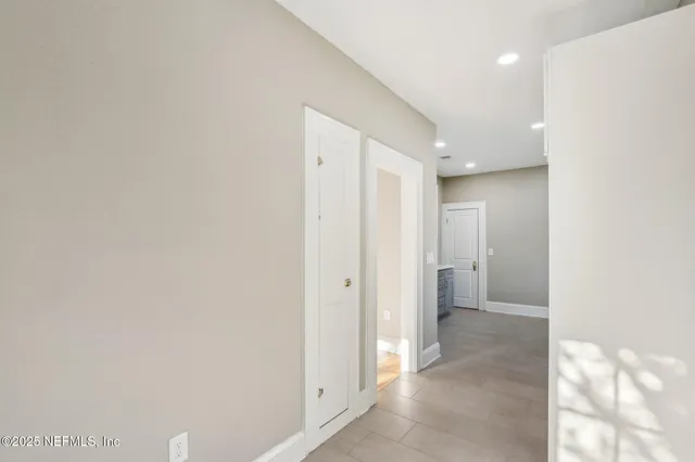a kitchen that has a sink and a stove in it