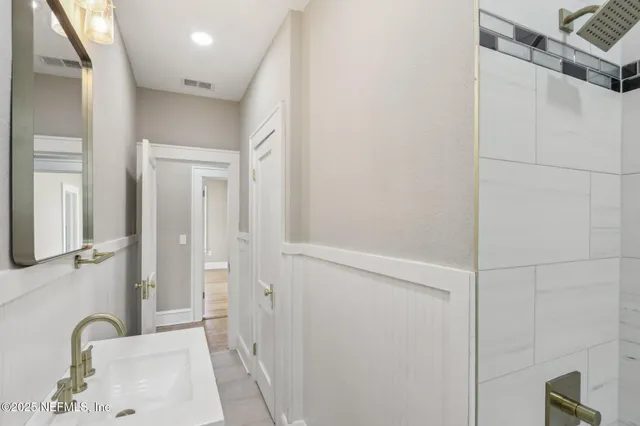 a view of a porch with a table and chairs